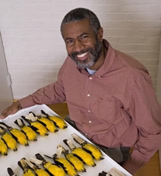 Scott Edwards posing with bird specimens